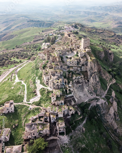 Aerial view of Craco, abandoned town on top of a hill photo