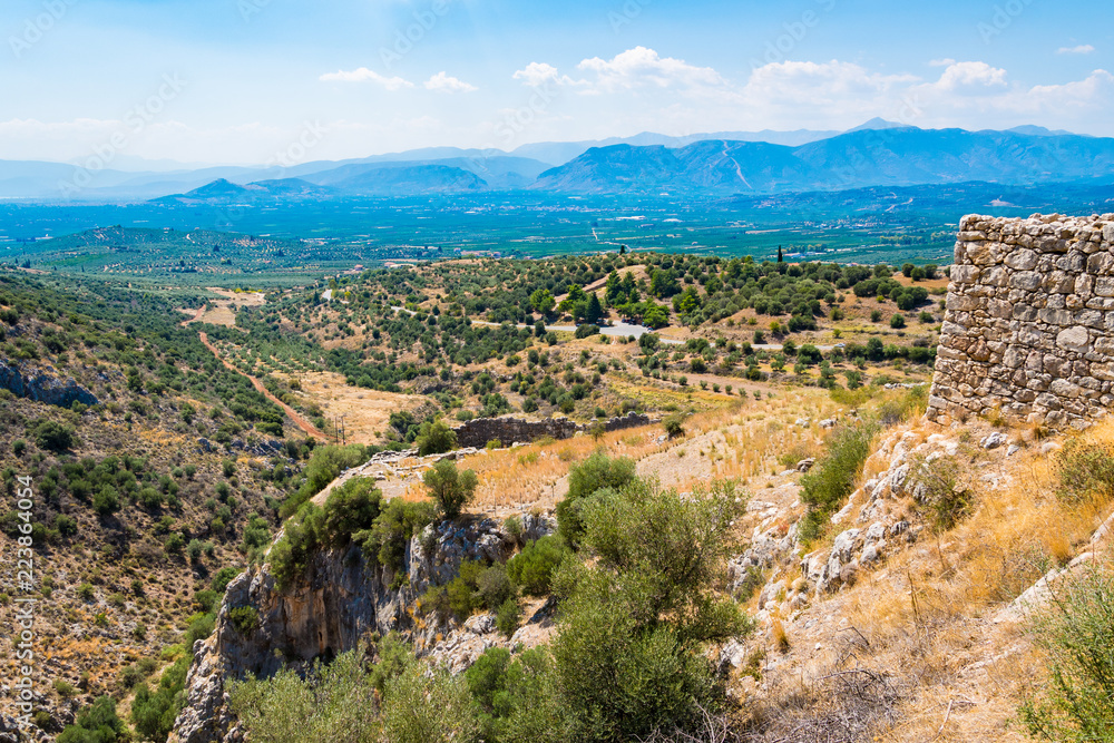 View of the mainland below from the Mycenean palace. Archaeological site of Mycenae in Peloponnese Greece