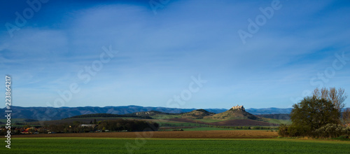 Northern panoramic view of Spis castle  Drevenik  Ostra hora and Slovak Ore Mountains in early spring with power lines removed from the picture