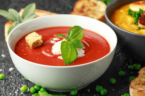 Photos Tomato and fresh basil soup with garlic, cracked pepper corns, served with parme