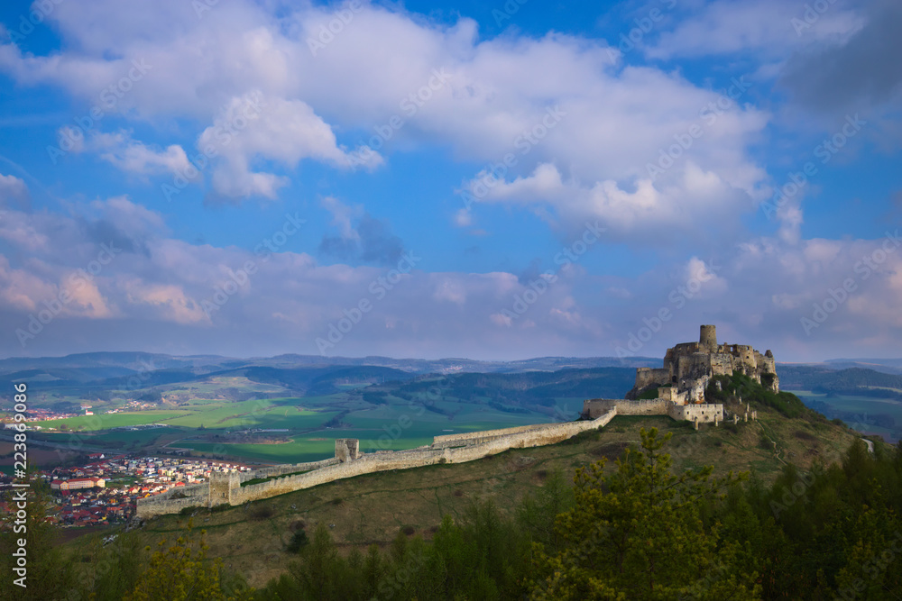 A southern view of the Spis castle and Spisske podhradie in the morning in early spring with dramatic cloudy sky