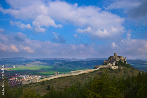 A southern view of the Spis castle and Spisske podhradie in the morning in early spring with dramatic cloudy sky