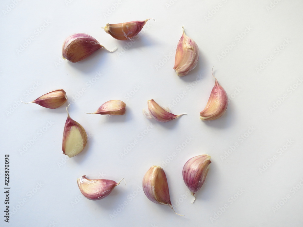 Garlic cloves on white background close-up