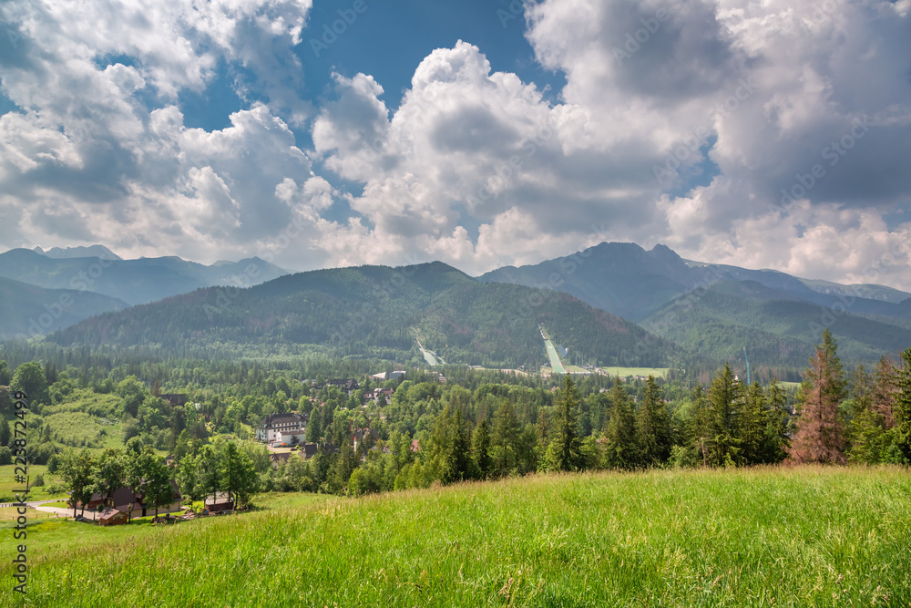 Fototapeta premium Mount Giewont and ski jump in cloudy, Poland