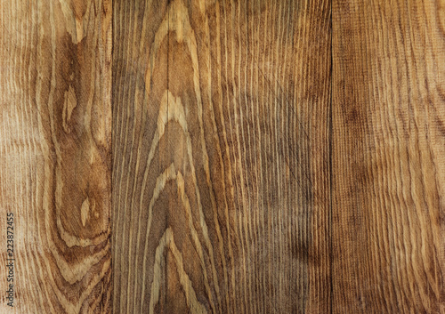 Brown wooden board with a pattern background texture, a wooden floor, a fence of natural wood, a surface of a teak wood background for design and decoration
