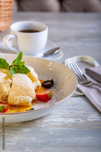 Close up view of beautiful elegant sweet dessert, Napoleon, served on the plate. Beautiful decoration, restaurant dish, ready to eat. Tea time, cozy atmosphere.