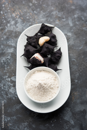 cooked Water chestnut with flour or powder, also known as singada/singara or shingada peeth, selective focus photo