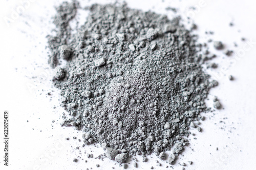 Фотография Natural colored pigment powder close up, matt grey eyeshadow or powder mica pigm