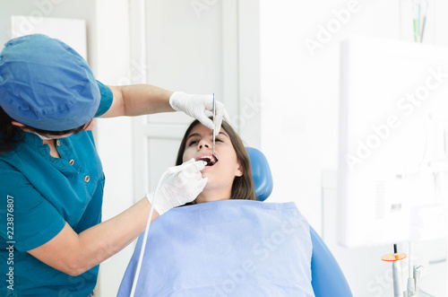 Dentist removing calculus