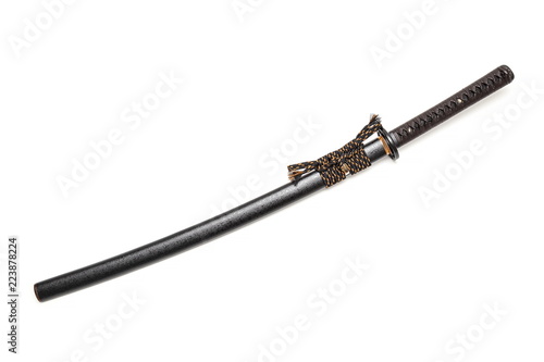 Brown leather cord tie on grip Japanese sword and black scabbard with steel fitting isolated in white background.