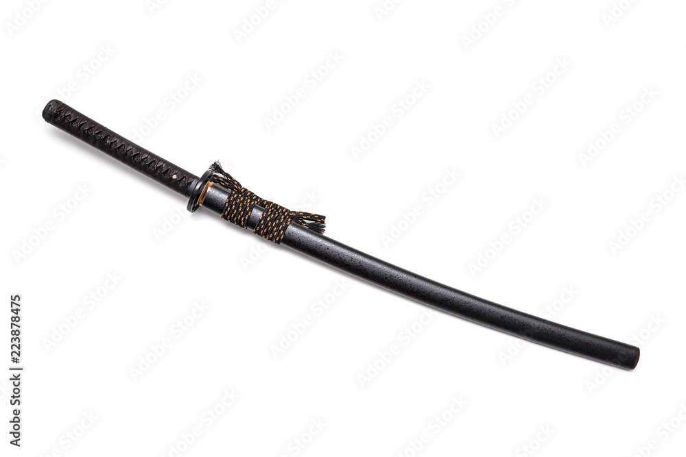 Brown leather cord tie on grip Japanese sword and black scabbard with steel fitting isolated in white background. Brown leather cord tie on grip Japanese sword and black scabbard with steel fitting isolated in white background.