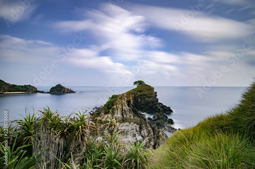 Terengganu most popular island, kapas Island surrounded by clear sea water and blue sky background. Rocky and white sandy beach. photo