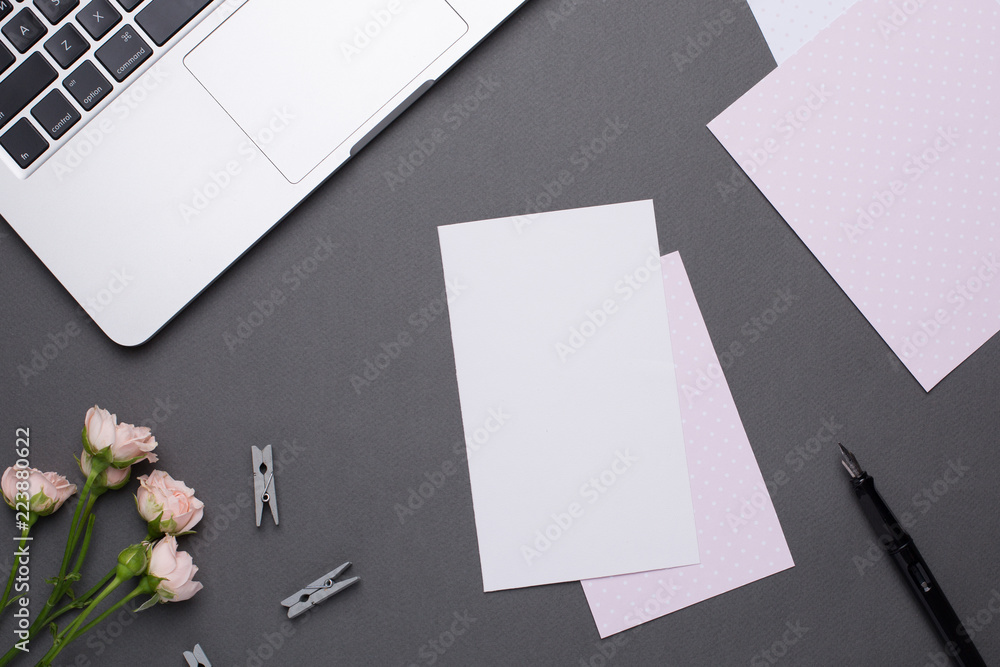 Empty white card with flowers on grey background in vintage style Empty white card with flowers on grey background in vintage style