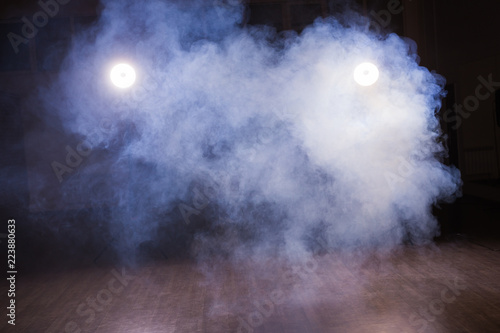 Background of an empty room with smoke and light. Dark blue abstract background in dance class