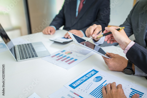 Group of business people discuss the financial investment at meeting.