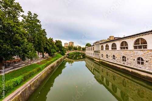 View of river in Ljubljana city. River in city centre, old architecture and historical building in Slovenia capital