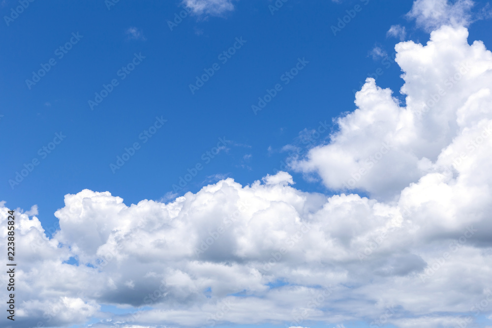 Fototapeta premium Blue sky background with white clouds, rain clouds on sunny summer or spring day.