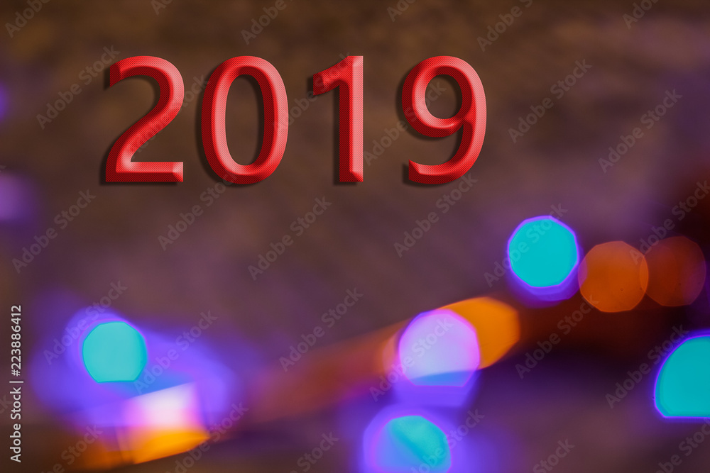 Christmas and New Year holidays design concept of colorful blue red and gold bokeh sparkles glares from garland lamps and 
