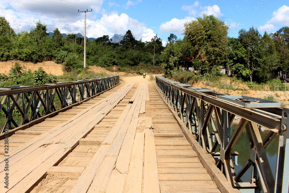 The wooden bridge for crossing the River in Vang Vieng