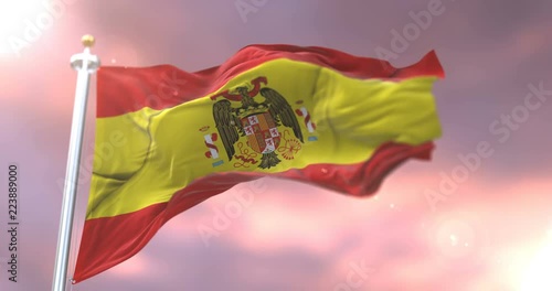 Flag of Spain in the Franco dictator era, pro Franco or francoist, waving at wind at sunset, loop photo