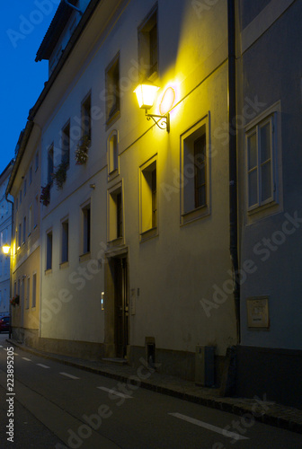 A Lantern Glowing on a Facade in Linz, Austria