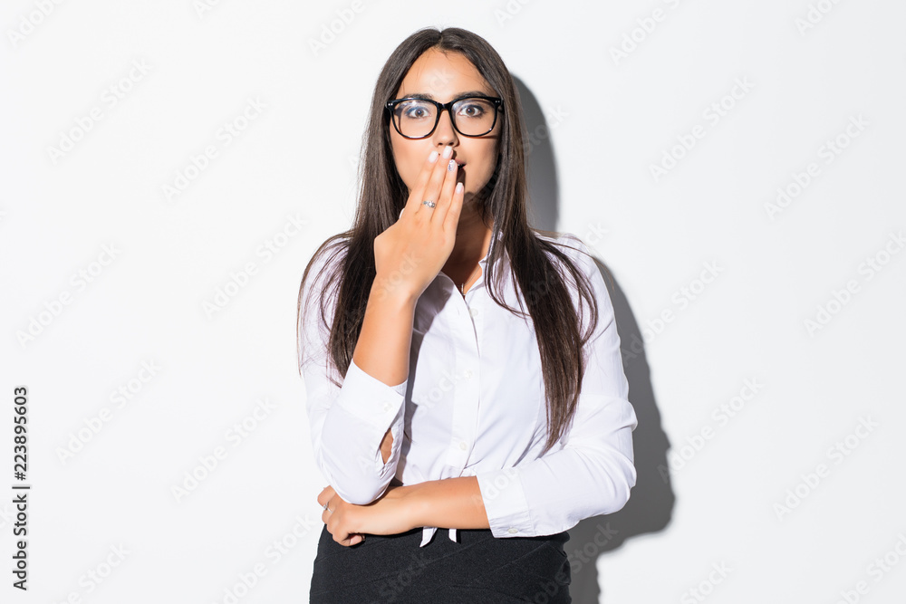 Exhausted or bored woman in yawn. Humorous high angle view of an exhausted or bored young woman yawning with her hand to her mouth and apathetic eyes, isolated on white background. Exhausted or bored woman in yawn. Humorous high angle view of an exhausted or bored young woman yawning with her hand to her mouth and apathetic eyes, isolated on white background.