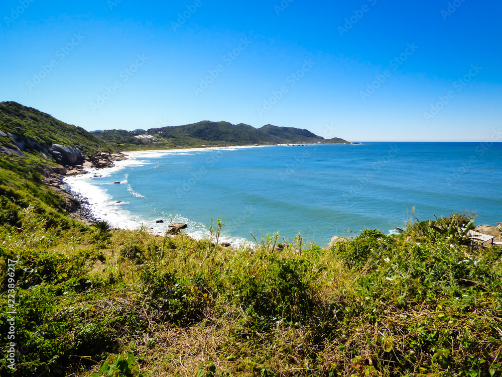 A view of the Atlantic ocean from a hiking path in Florianopolis, Brazil