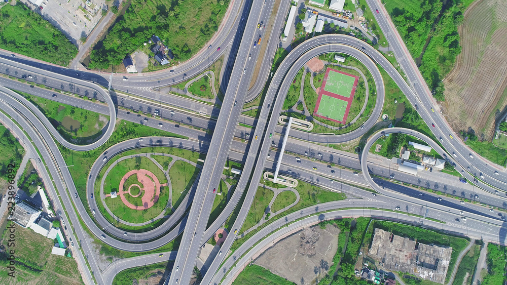 Beautiful pattern Aerial view highway road network intersection traffic. Can use for import export or transportation concept. Beautiful pattern Aerial view highway road network intersection traffic. Can use for import export or transportation concept.