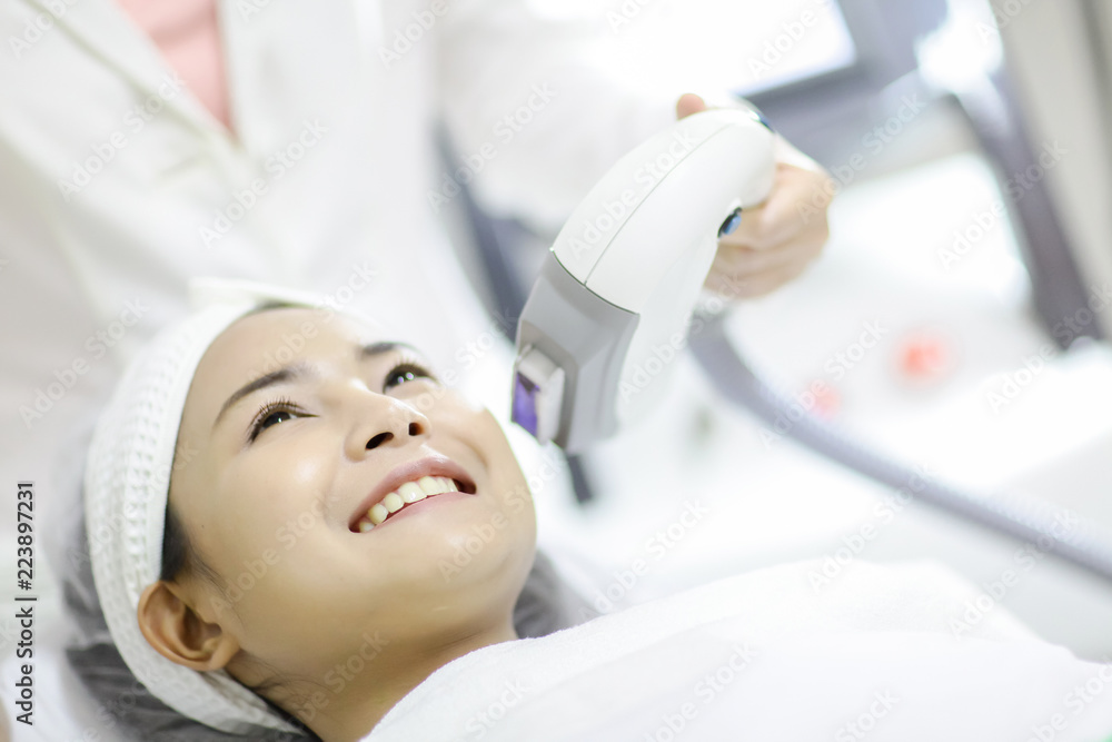Laser Machine.Young woman receiving laser treatment.Skin Care.Young Woman Receiving Facial Beauty Treatment, Removing Pigmentation At Cosmetic Clinic.IPL. Photo Facial Therapy.Anti-aging Procedures. Laser Machine.Young woman receiving laser treatment.Skin Care.Young Woman Receiving Facial Beauty Treatment, Removing Pigmentation At Cosmetic Clinic.IPL. Photo Facial Therapy.Anti-aging Procedures.