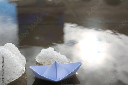 paper boat in a pool