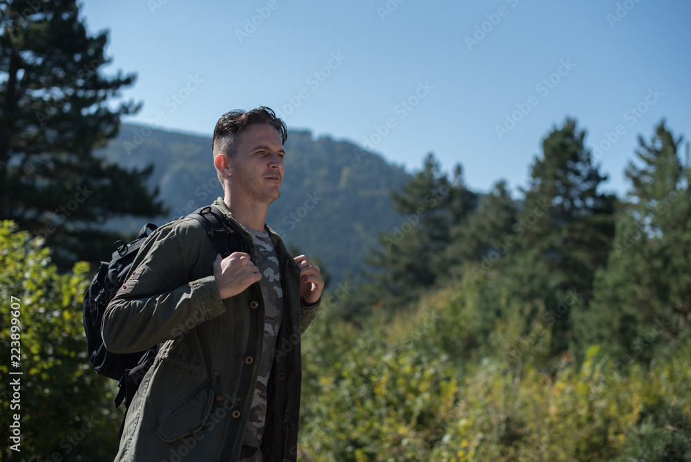 Naklejka premium serious hiker with backpack 