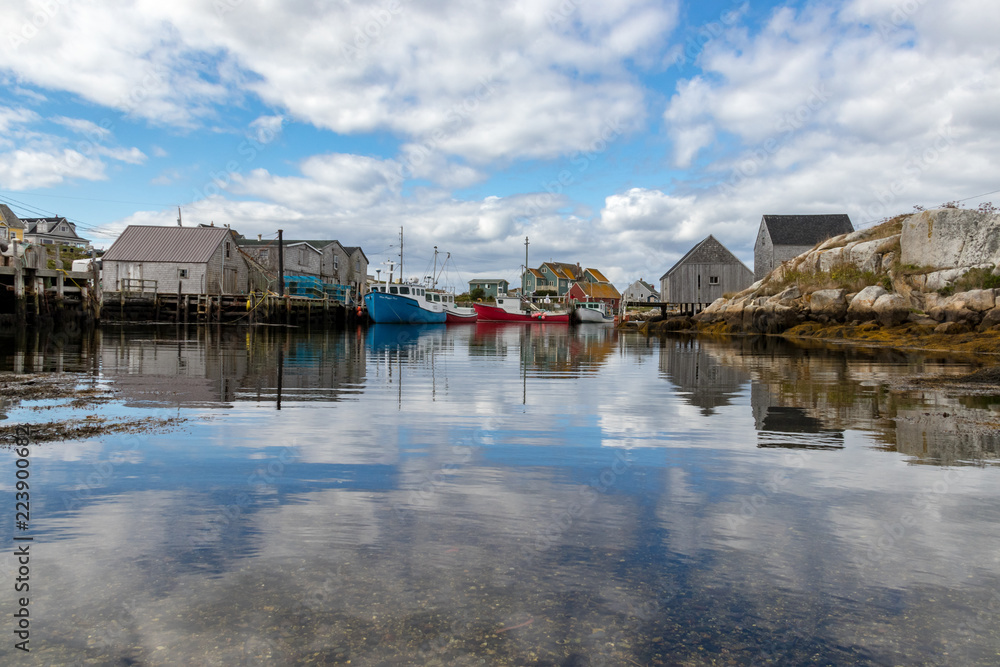 Fototapeta premium Clouds reflected in harbour water, Peggy's Cove Harbour