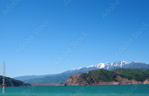 Charvak Lake and mountain in Uzbekistan with blank blue copy space 