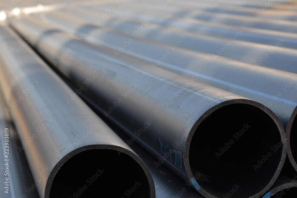 Fototapeta premium Plastic pipes in stock of finished products stacked in packs