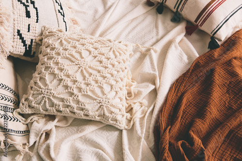 White pillow and blanket on a bed. Bedroom, interior
