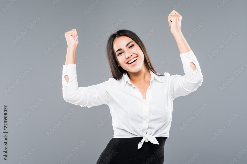 Successful businesswoman with arms up isolated over a white background Successful businesswoman with arms up isolated over a white background