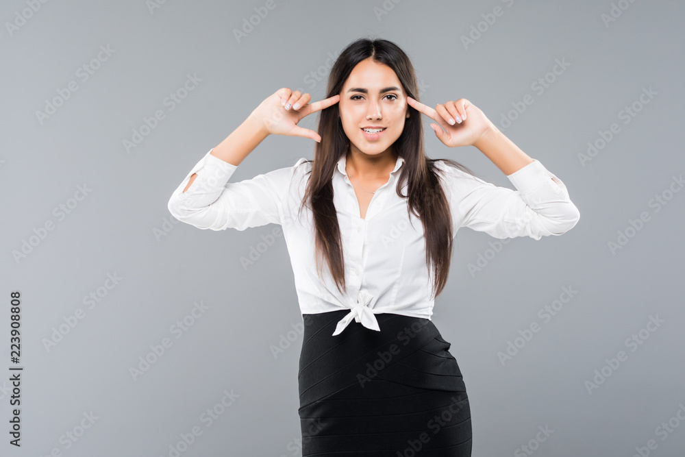 Young businesswoman covering her ears and shouting over white background Young businesswoman covering her ears and shouting over white background