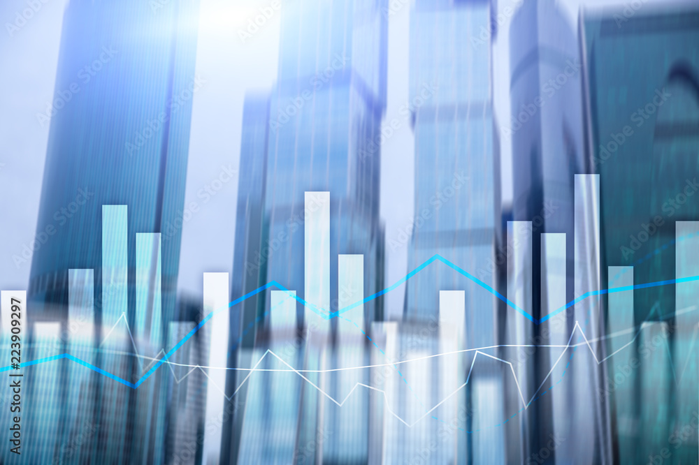 Financial graphs and charts on blurred business center background. Invesment and trading concept. Financial graphs and charts on blurred business center background. Invesment and trading concept.