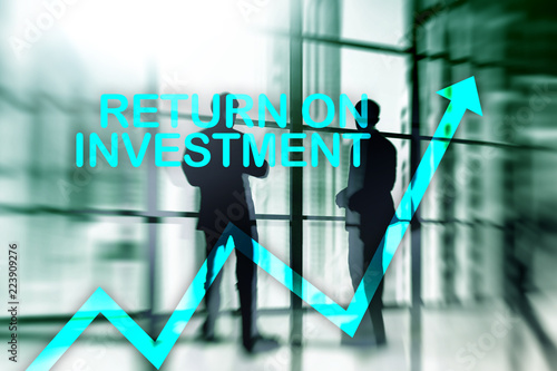 ROI - Return on investment. Stock trading and financial growth concept on blurred business center background.