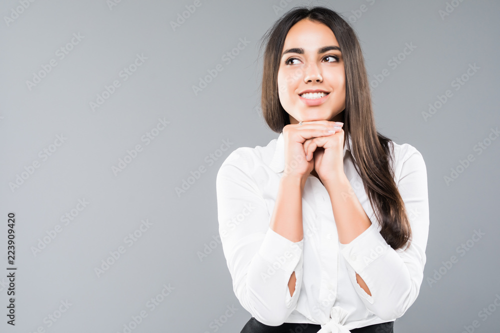 Portrait of young attractive business woman very satisfied look isolated on gray background Portrait of young attractive business woman very satisfied look isolated on gray background
