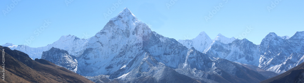 Amazing Shot Panoramic view of Nepalese Himalayas mountain peaks covered with white snow attract many climbers, some of them highly experienced mountaineers