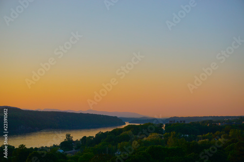 Poughkeepsie, New York: View of sunset over the Hudson River, with the Catskill Mountains in the background, from the Walkway Over the Hudson.