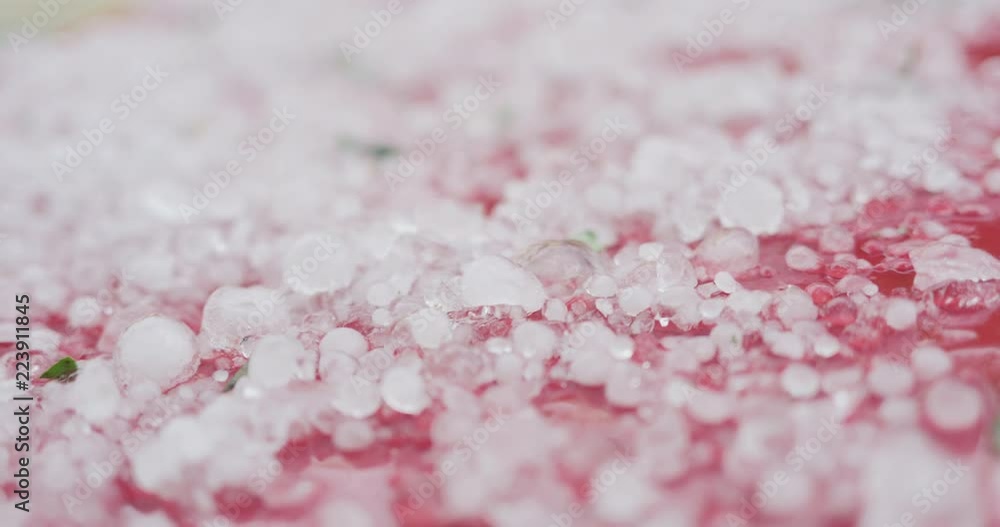 Slow motion closeup of hailstones on red car after strong hailstorm Slow motion closeup of hailstones on red car after strong hailstorm