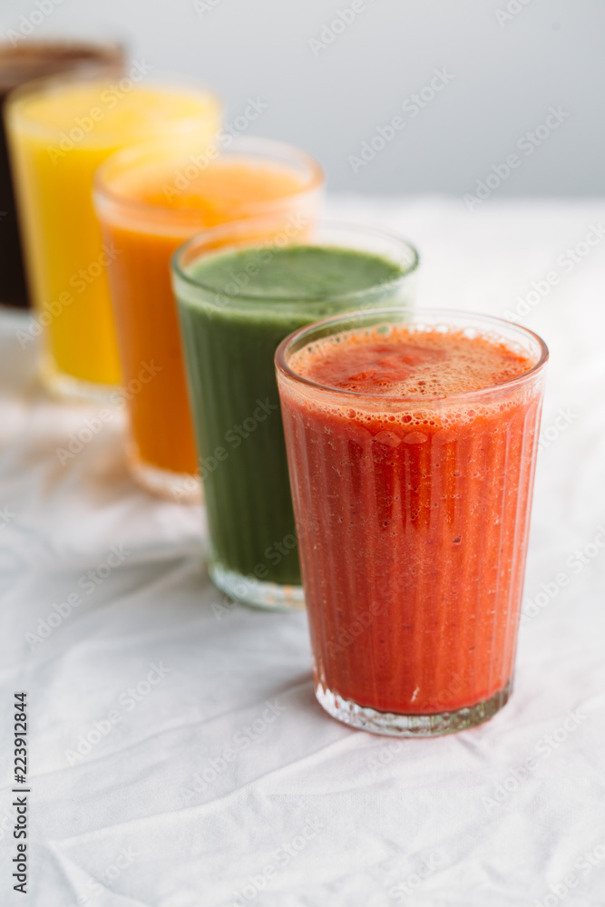 Colorful smoothies in glass with fresh tropical fruit and superfoods Colorful smoothies in glass with fresh tropical fruit and superfoods