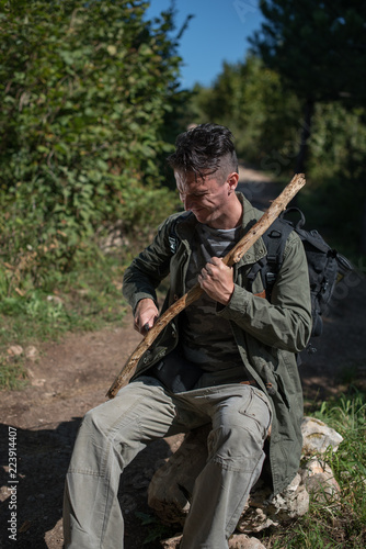 hiker carving stick 