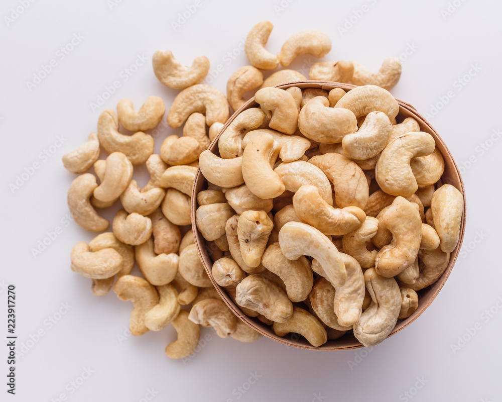 cashew nuts on a white acrylic background cashew nuts on a white acrylic background