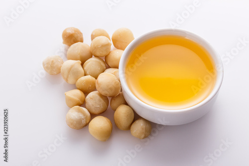 delicious macadamia nuts on a white acrylic background