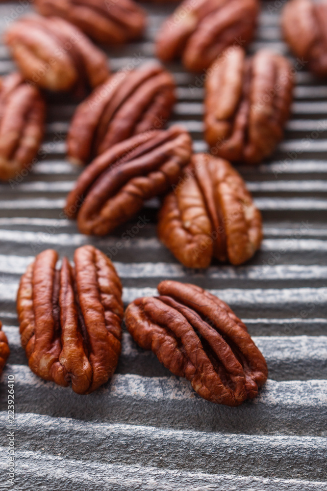 delicious pecan nuts on a rustic wooden background delicious pecan nuts on a rustic wooden background
