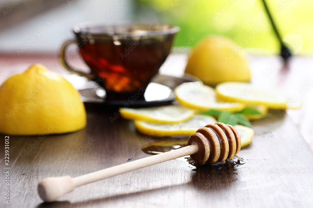 Fresh honey with a cup of black tea Fresh honey with a cup of black tea
