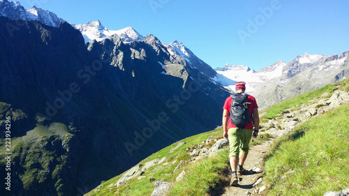 Austria. Alpine region "Stubai". The Oberbergtal Valley. Climber on a mountain path.